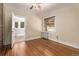 Bedroom with hardwood floors, radiator, and natural light, offers a cozy retreat at 1601 Jackson St, Denver, CO 80206