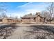 Brick house with manicured landscaping, wood fence and garage at 1601 Jackson St, Denver, CO 80206