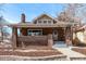 Inviting brick home with craftsman-style features, a gabled roof, and a welcoming front porch at 1601 Jackson St, Denver, CO 80206