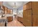 Bright kitchen featuring stainless steel appliances, hardwood floors, and ample counter space at 1601 Jackson St, Denver, CO 80206