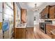 Charming kitchen with stainless steel appliances, wooden cabinets, and hardwood floors at 1601 Jackson St, Denver, CO 80206