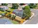 Aerial view of the home showcasing the fenced backyard, mature trees, and quiet street at 1705 Cathay Ct, Aurora, CO 80011