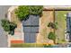 Birds eye view of the house showing roof and backyard fenced in yard on a sunny day at 1705 Cathay Ct, Aurora, CO 80011