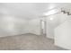 Spacious basement area featuring neutral carpet and staircase at 1705 Cathay Ct, Aurora, CO 80011