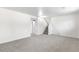 Spacious basement area featuring neutral carpet and staircase at 1705 Cathay Ct, Aurora, CO 80011