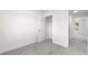 A bright bedroom with an open closet and white door at 1705 Cathay Ct, Aurora, CO 80011