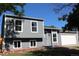 Charming gray two-story home with an attached garage and well-maintained front yard at 1705 Cathay Ct, Aurora, CO 80011