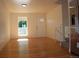Inviting living room with hardwood floors, a window, and a staircase at 1705 Cathay Ct, Aurora, CO 80011