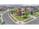 Aerial view of the home featuring a lush backyard with a fire pit and attractive landscaping at 22965 Allendale Ave, Parker, CO 80138