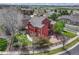 Aerial view of the rear of this home, with a patio, yard, and outdoor seating at 22965 Allendale Ave, Parker, CO 80138