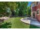 Private backyard includes patio with seating and a well-manicured lawn at 22965 Allendale Ave, Parker, CO 80138