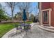 Backyard patio with outdoor dining area and a view of the meticulously landscaped yard and fence at 22965 Allendale Ave, Parker, CO 80138