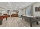 Finished basement providing entertainment space with a home theatre, game table, and lounge area at 22965 Allendale Ave, Parker, CO 80138