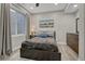 Cozy bedroom featuring a large window, soft lighting, and neutral decor, creating a tranquil retreat at 22965 Allendale Ave, Parker, CO 80138