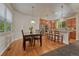 Bright dining area with hardwood floors, pendant lighting, and kitchen bar seating at 22965 Allendale Ave, Parker, CO 80138