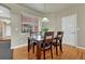 Cozy dining area featuring a wood table, modern light fixture, and ample natural light at 22965 Allendale Ave, Parker, CO 80138