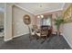 Elegant dining room featuring a round table, stylish chairs, and a decorative china cabinet at 22965 Allendale Ave, Parker, CO 80138