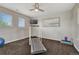 A bright, spacious home gym with a treadmill and plenty of room for your favorite exercise equipment at 22965 Allendale Ave, Parker, CO 80138