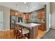 Modern kitchen featuring stainless steel appliances, a center island with seating, and stylish cabinetry at 22965 Allendale Ave, Parker, CO 80138