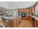 Beautiful kitchen with a large island, stainless steel appliances, and hardwood floors at 22965 Allendale Ave, Parker, CO 80138