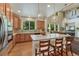 Bright, open kitchen with a large island, modern appliances, and beautiful pendant lighting at 22965 Allendale Ave, Parker, CO 80138