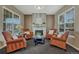 Bright and open living room features neutral walls and furniture, fireplace, and natural light at 22965 Allendale Ave, Parker, CO 80138