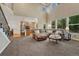 Open concept living room with high ceilings and open views of the kitchen and dining room at 22965 Allendale Ave, Parker, CO 80138
