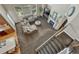 Inviting living room with a plush sectional sofa, fireplace, and large windows offering ample natural light at 22965 Allendale Ave, Parker, CO 80138