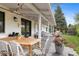 Back patio with string lights, dining and seating areas, and views of backyard at 5965 S Gaylord Way, Greenwood Village, CO 80121