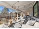 Back porch with a lounge and seating, string lights and a backyard view at 5965 S Gaylord Way, Greenwood Village, CO 80121
