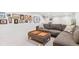 Basement with a comfortable sofa and gallery wall, ideal for relaxing and entertaining at 5965 S Gaylord Way, Greenwood Village, CO 80121