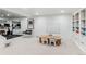 Basement features a table, whiteboard, and mirror-mounted workout area at 5965 S Gaylord Way, Greenwood Village, CO 80121