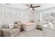 Bedroom with a trundle bed, chair, ceiling fan, and lots of natural light at 5965 S Gaylord Way, Greenwood Village, CO 80121