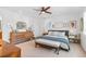 Bright bedroom featuring a ceiling fan, light hardwood floors, and lots of natural light at 5965 S Gaylord Way, Greenwood Village, CO 80121