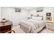 Neutral bedroom featuring a cozy bed, a desk and chair, plus a window at 5965 S Gaylord Way, Greenwood Village, CO 80121