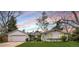 Charming single-story home with a well-manicured lawn and a brick-accented facade at 5965 S Gaylord Way, Greenwood Village, CO 80121