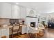 Home office area with a built-in desk, cabinetry, and fireplace at 5965 S Gaylord Way, Greenwood Village, CO 80121