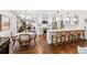 Bright, open-concept kitchen and dining area with hardwood floors and modern fixtures at 5965 S Gaylord Way, Greenwood Village, CO 80121