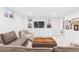 Cozy living room features built-in shelves, cabinets, and comfortable seating, perfect for relaxation at 5965 S Gaylord Way, Greenwood Village, CO 80121