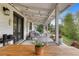Inviting backyard patio with string lights, outdoor dining set, and view of the landscaped yard at 5965 S Gaylord Way, Greenwood Village, CO 80121