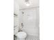 Bright bathroom with a bathtub and shower combination with a mosaic tile floor at 5965 S Gaylord Way, Greenwood Village, CO 80121