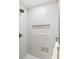Shower with a bronze shower head and stylish tile work at 5965 S Gaylord Way, Greenwood Village, CO 80121
