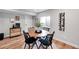 Basement dining area with wood table and four chairs at 11960 S Allerton Cir, Parker, CO 80138