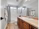 Clean bathroom with a shower/tub combo and wood vanity at 11960 S Allerton Cir, Parker, CO 80138