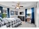 Bright bedroom with double windows, dresser, and desk at 11960 S Allerton Cir, Parker, CO 80138