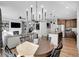 Open concept dining area with kitchen views and chandelier at 11960 S Allerton Cir, Parker, CO 80138