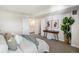 Bright bedroom with an ensuite bathroom, carpeted floor, and tastefully curated decor at 2880 S Locust St # 704N, Denver, CO 80222