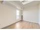 Well-lit bedroom with skylight and wood-look flooring at 2880 S Locust St # 704N, Denver, CO 80222