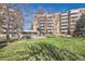 Building with surrounding green space and trees at 2880 S Locust St # 704N, Denver, CO 80222