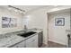 Bright kitchen featuring granite countertops and stainless steel appliances at 2880 S Locust St # 704N, Denver, CO 80222